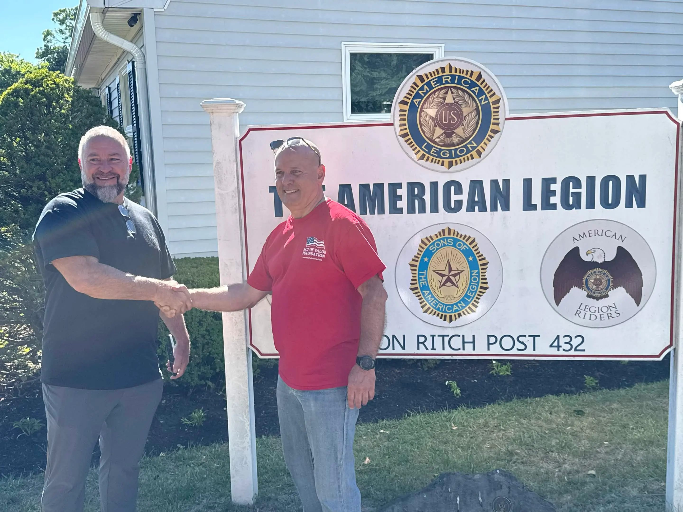 Madison Ave Construction shaking hands with an American Legion Post 432 member