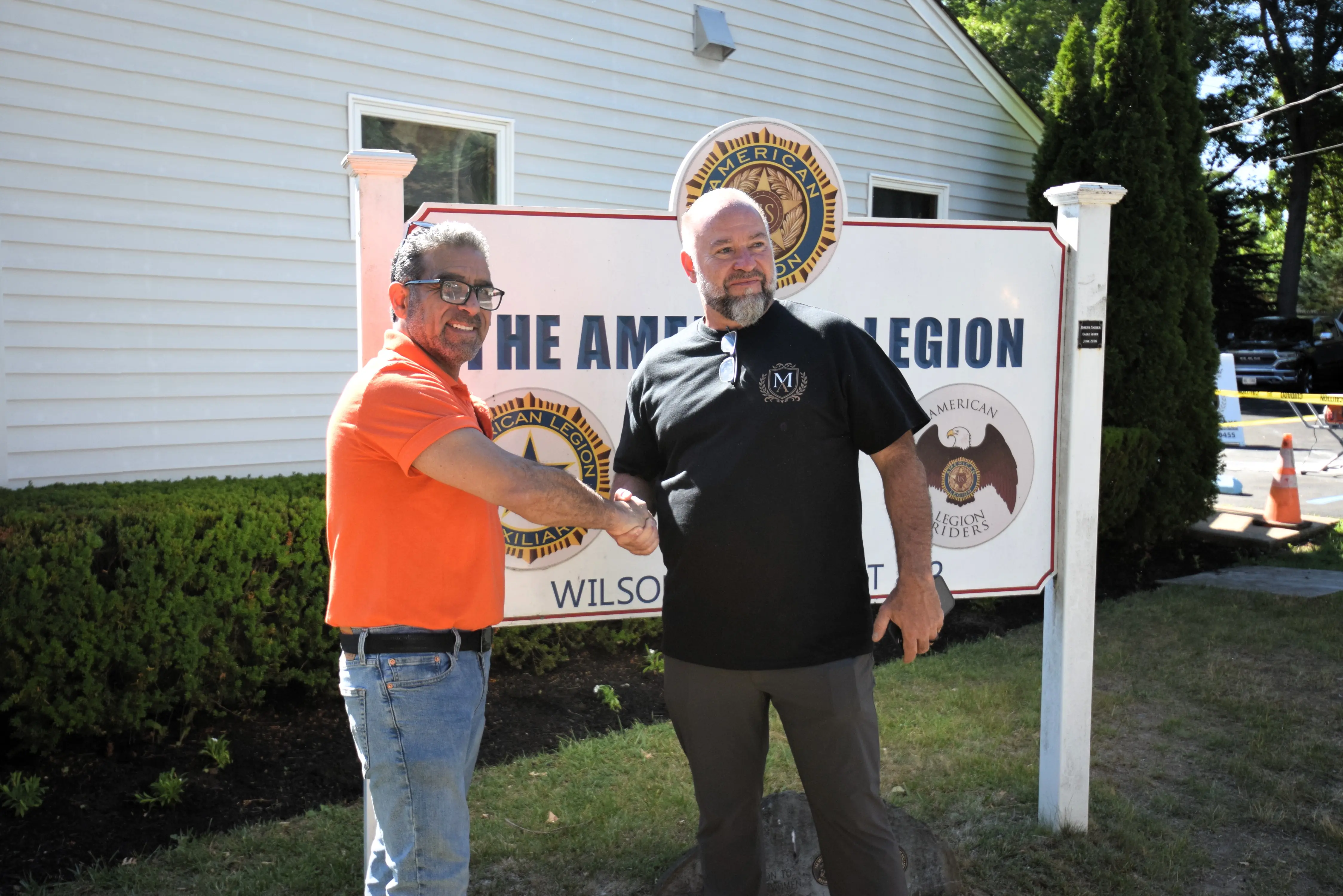 Madison Ave Construction shaking hands with an American Legion Post 432 member