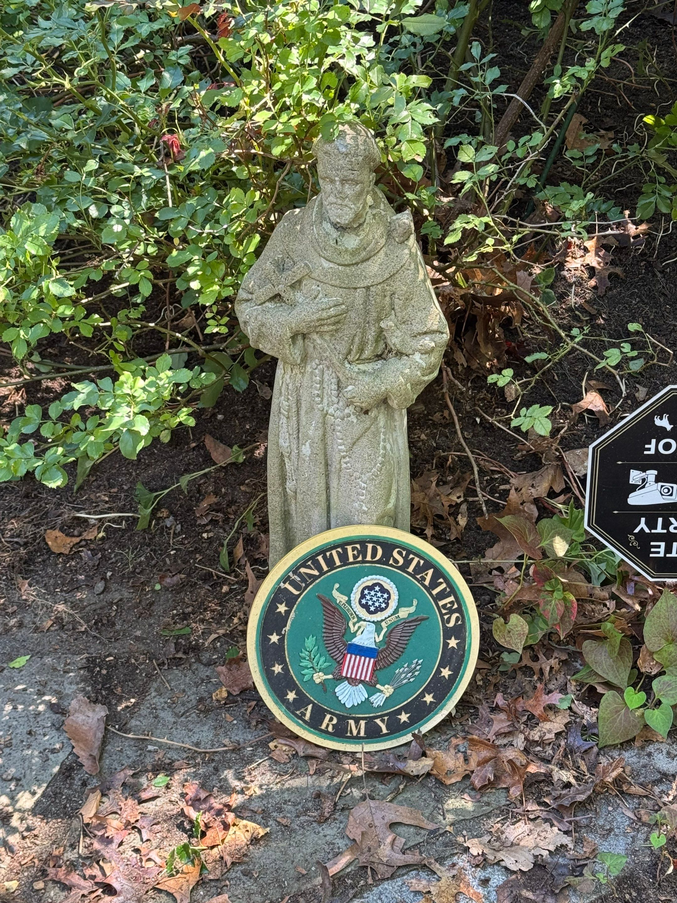 A United States Army emblem beside the garden at the veteran's home